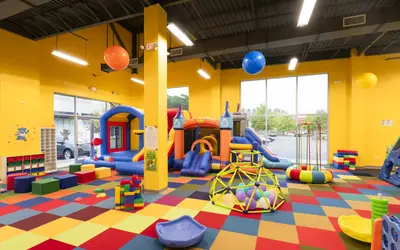 Indoor playground with bounce houses and ball pit at Big Bear Bounce